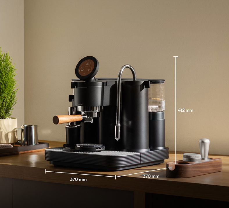 Black Meraki espresso machine with labelled dimensions of 370 mm wide, 370 mm deep and 412 mm high