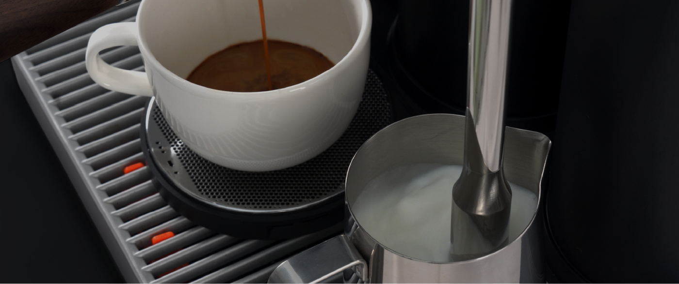 High-end professional espresso machine Meraki performing simultaneous brewing and milk steaming with dual-boiler system